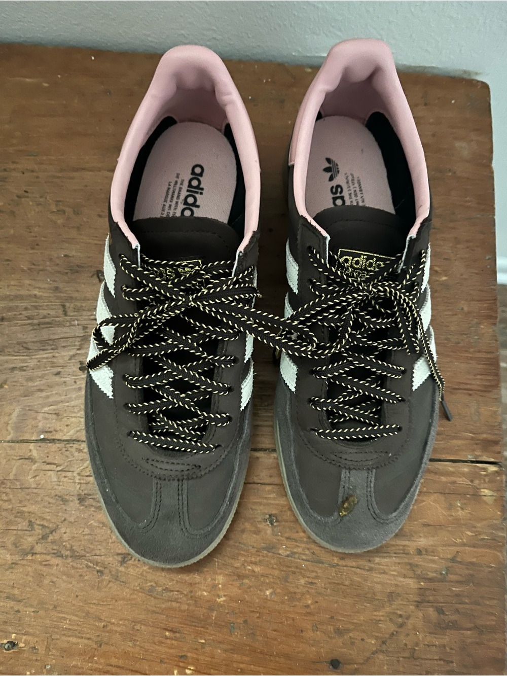 adidas Women’s Brown Suede Sneakers with Pink Collar and White Stripes.